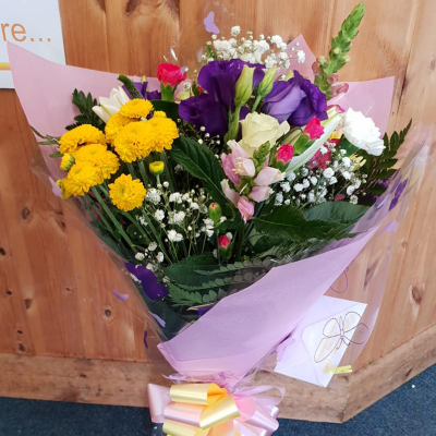 Wrap of Loveliness - A simple wrap of mixed flowers to convey your message will be put together from the finest collection of flowers on the day by a real local florist.